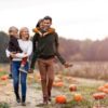 family in pumpkin patch